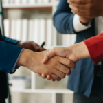 Consultants shaking hands with clients